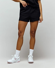 Womens Olivia Fleece Short, black relaxed-fit French terry shorts with a smooth texture and comfortable elastic waistband. No visible Psycho Bunny skull logo.