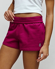 Womens Olivia Fleece Short, deep magenta, relaxed fit, soft fleece shorts with an elasticated waistband, side pockets, and a small embroidered white, black, and pink Psycho Bunny skull logo on the lower left leg. (3)
