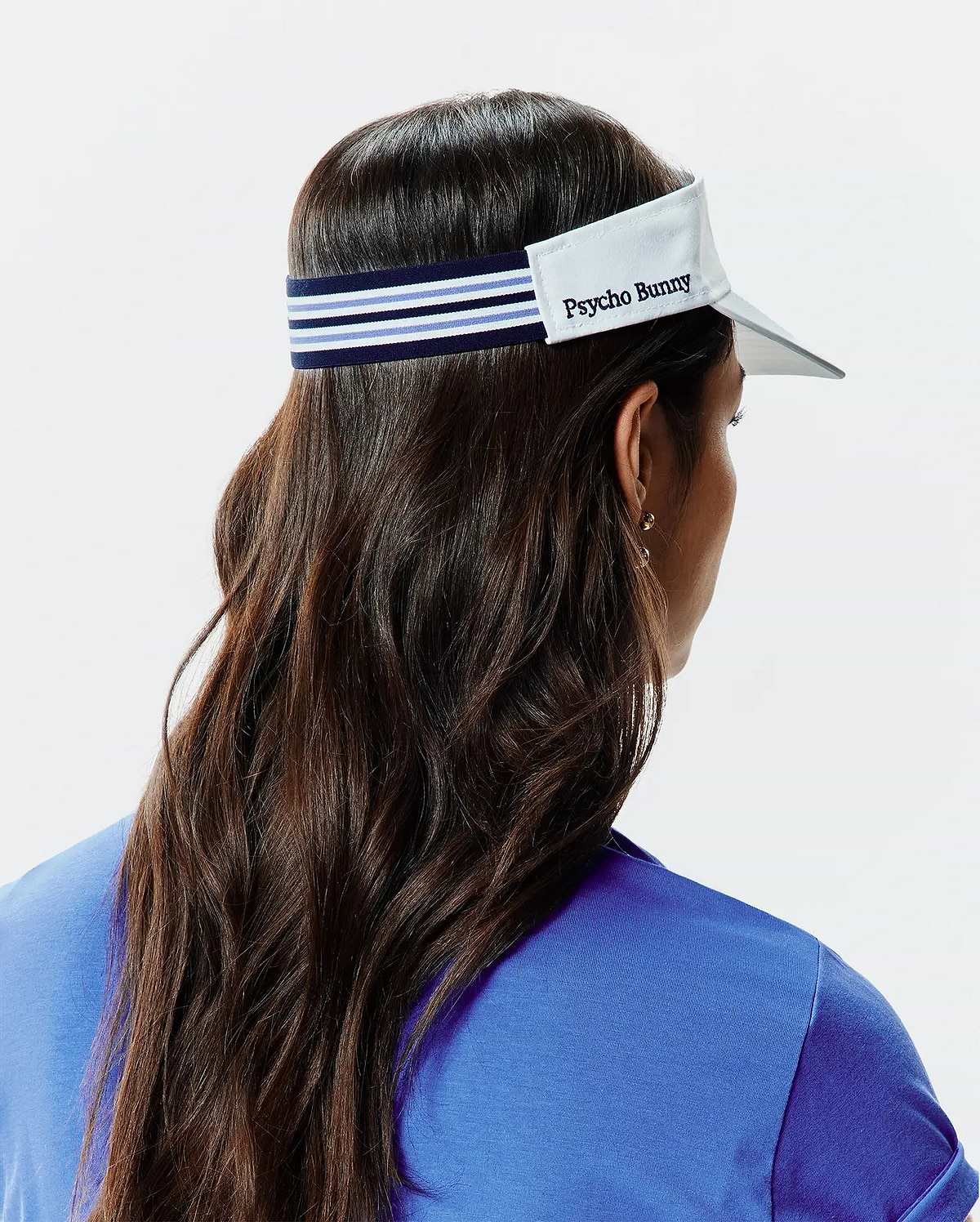 Women's Sport Visor featuring a crisp white brim, a navy blue elastic strap with light blue and white stripes, and an embroidered Psycho Bunny text logo on the front. (3)
