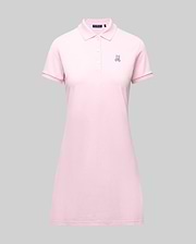 The Psycho Bunny WOMENS POLO DRESS - WO2000003 is a light pink Pima polo dress with a feminine fit, collar, three Mother-of-Pearl buttons, and a small embroidered bunny logo on the left chest, shown on a plain gray background. (7)