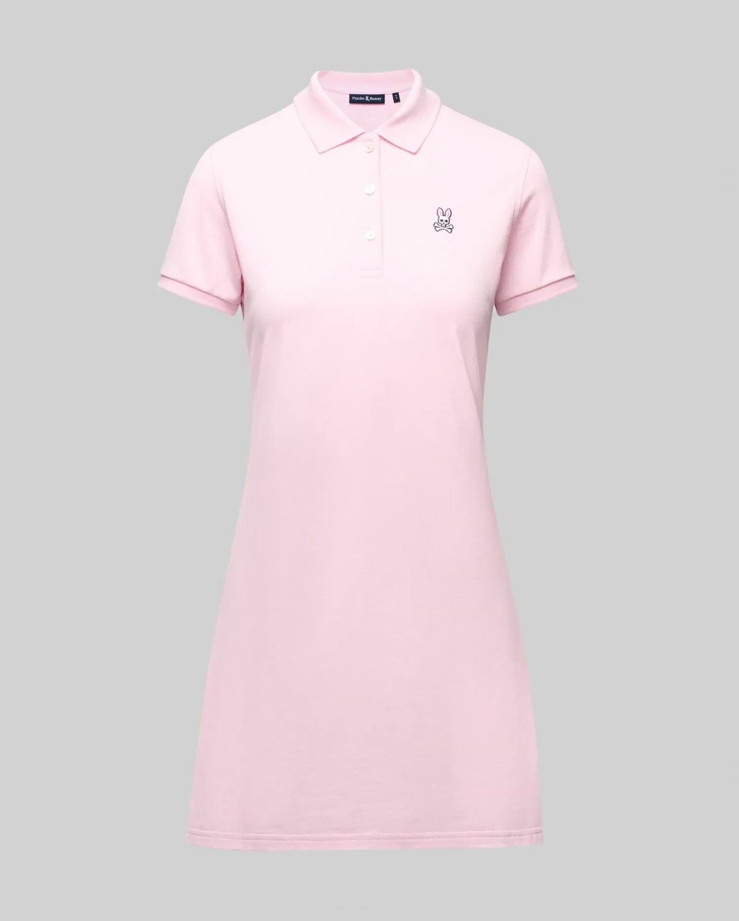 The Psycho Bunny WOMENS POLO DRESS - WO2000003 is a light pink Pima polo dress with a feminine fit, collar, three Mother-of-Pearl buttons, and a small embroidered bunny logo on the left chest, shown on a plain gray background. (7)