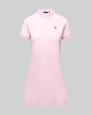 The Psycho Bunny WOMENS POLO DRESS - WO2000003 is a light pink Pima polo dress with a feminine fit, collar, three Mother-of-Pearl buttons, and a small embroidered bunny logo on the left chest, shown on a plain gray background. (7)