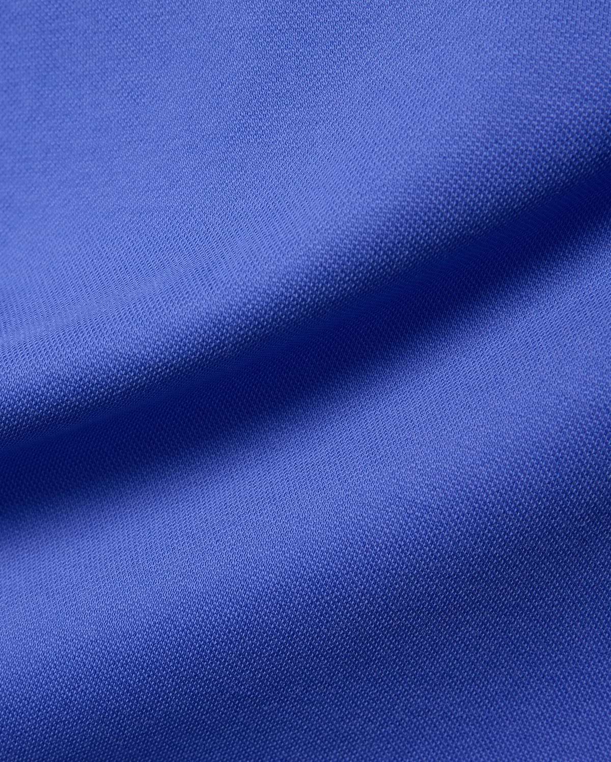 Women's Clara Pique Dress in a rich, vibrant royal blue, showcasing the signature textured pique fabric, embodying Psycho Bunny's premium streetwear aesthetic.