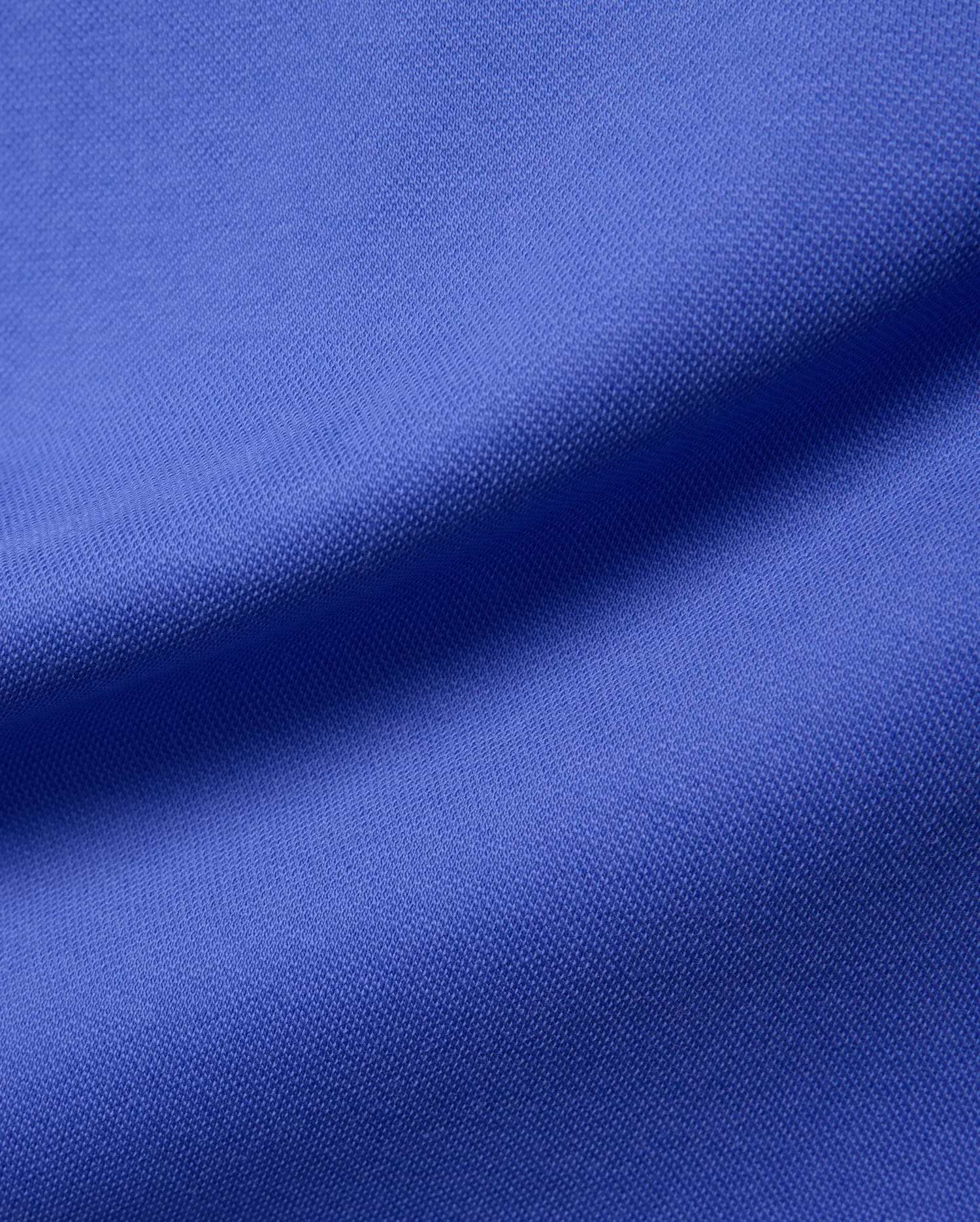 Women's Clara Pique Dress in a rich, vibrant royal blue, showcasing the signature textured pique fabric, embodying Psycho Bunny's premium streetwear aesthetic.