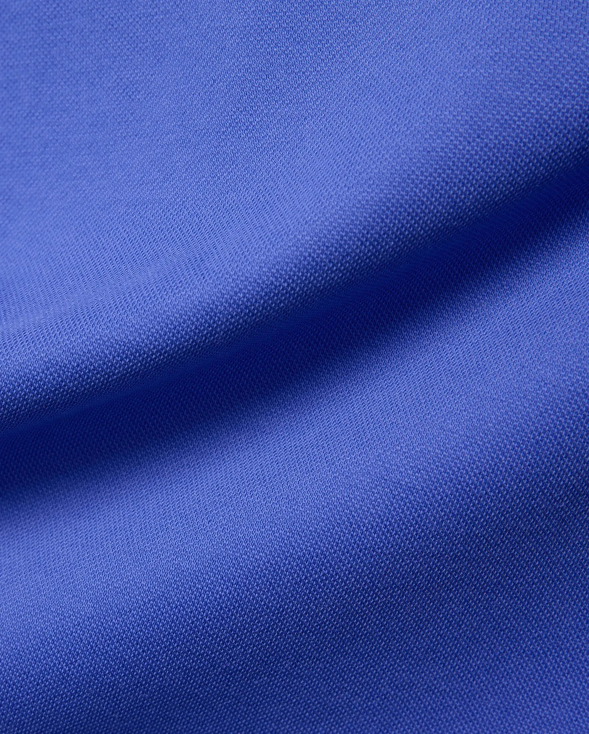 Women's Clara Pique Dress in a rich, vibrant royal blue, showcasing the signature textured pique fabric, embodying Psycho Bunny's premium streetwear aesthetic.