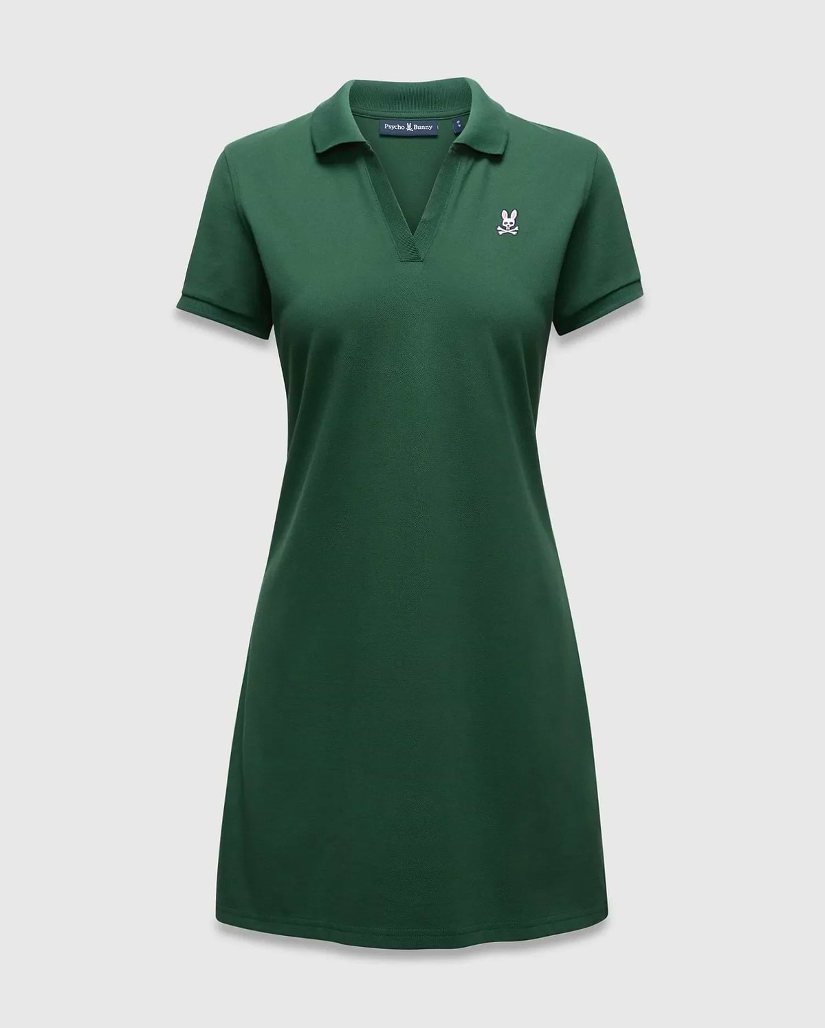 Women's Clara Pique Dress, a dark green polo dress with a classic fit, pique knit texture, and a small embroidered white and pink Psycho Bunny skull logo on the left chest. (5)