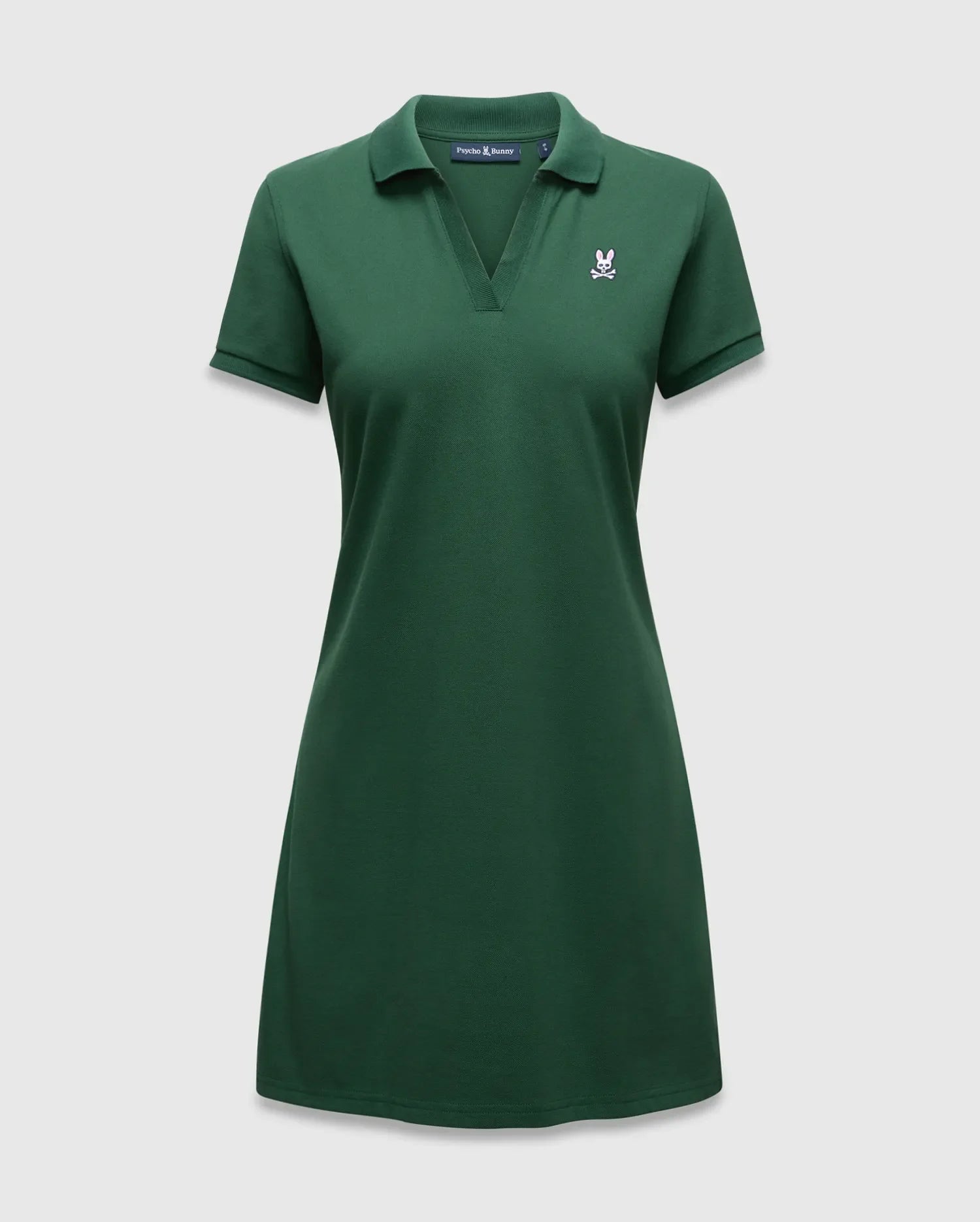 Women's Clara Pique Dress, a dark green polo dress with a classic fit, pique knit texture, and a small embroidered white and pink Psycho Bunny skull logo on the left chest. (5)