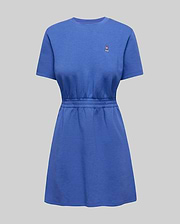 Womens Penelope Dress in blue soft jersey, featuring a relaxed fit, short sleeves, cinched elasticated waist, A-line skirt, and a small embroidered Psycho Bunny skull logo on the left chest. (4)