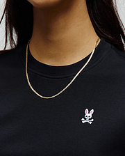 Black jersey knit Womens Penelope Dress with a classic fit, featuring a small embroidered white and pink Psycho Bunny skull logo on the left chest. (2)