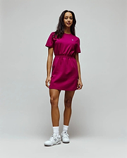 Womens Penelope Dress, a vibrant magenta jersey mini dress with a relaxed fit, crew neck, short sleeves, and an elasticated waist, featuring a small white embroidered Psycho Bunny skull logo on the left chest. (2)