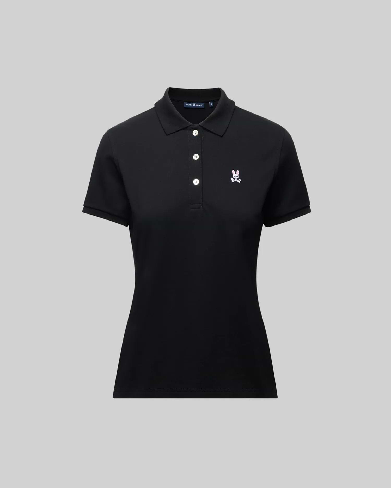 The Psycho Bunny WOMENS PIQUE POLO - WT0100003 is a black short-sleeve women’s polo with a collar, three white buttons, and a 4k-stitch embroidered Bunny logo on the left chest, shown on a plain gray background.