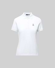The WOMENS PIQUE POLO - WT0100003 by Psycho Bunny is a white pique polo featuring a collar, buttons, and the embroidered Bunny logo on the left chest. Crafted for Pima flexibility, it is presented against a plain grey background.