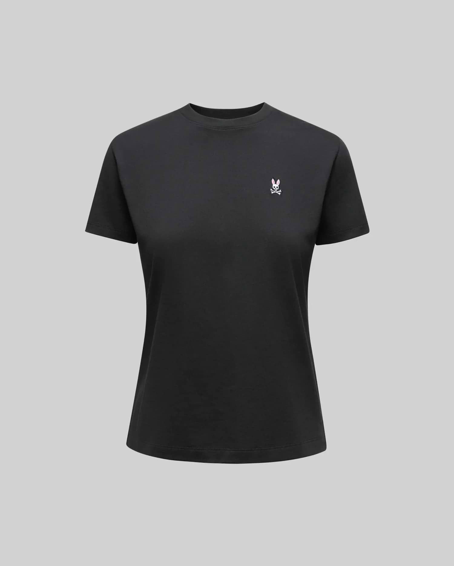 The Psycho Bunny WOMENS CLASSIC TEE - WT0200005 is a plain black Pima cotton shirt with a small white 4k stitch Bunny logo on the left chest, shown on a neutral gray background.