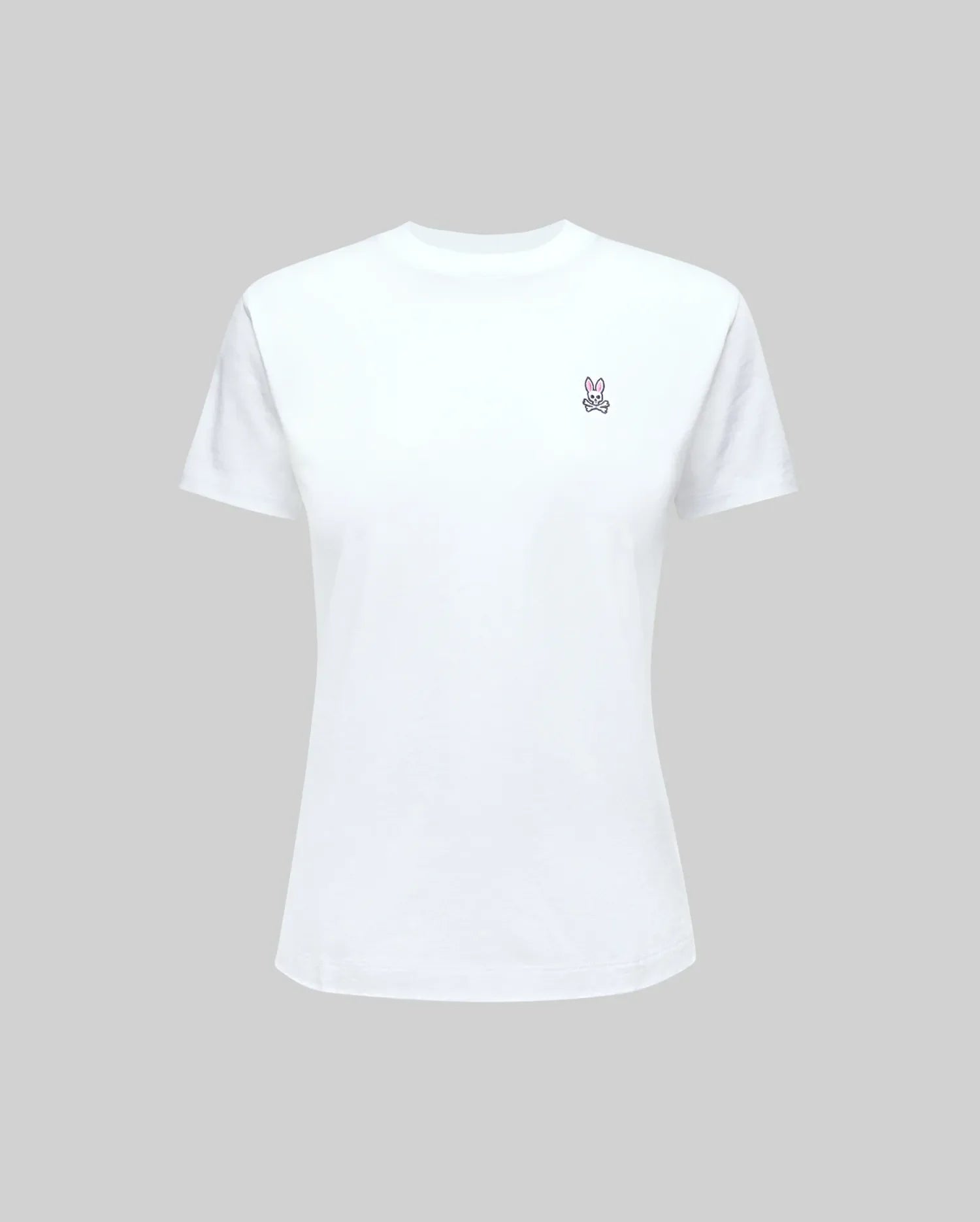 The Psycho Bunny WOMENS CLASSIC TEE - WT0200005 is made from 100% Pima cotton, featuring a rib knit crew neck and a small embroidered peace sign on the left chest. Shown on a light gray background.