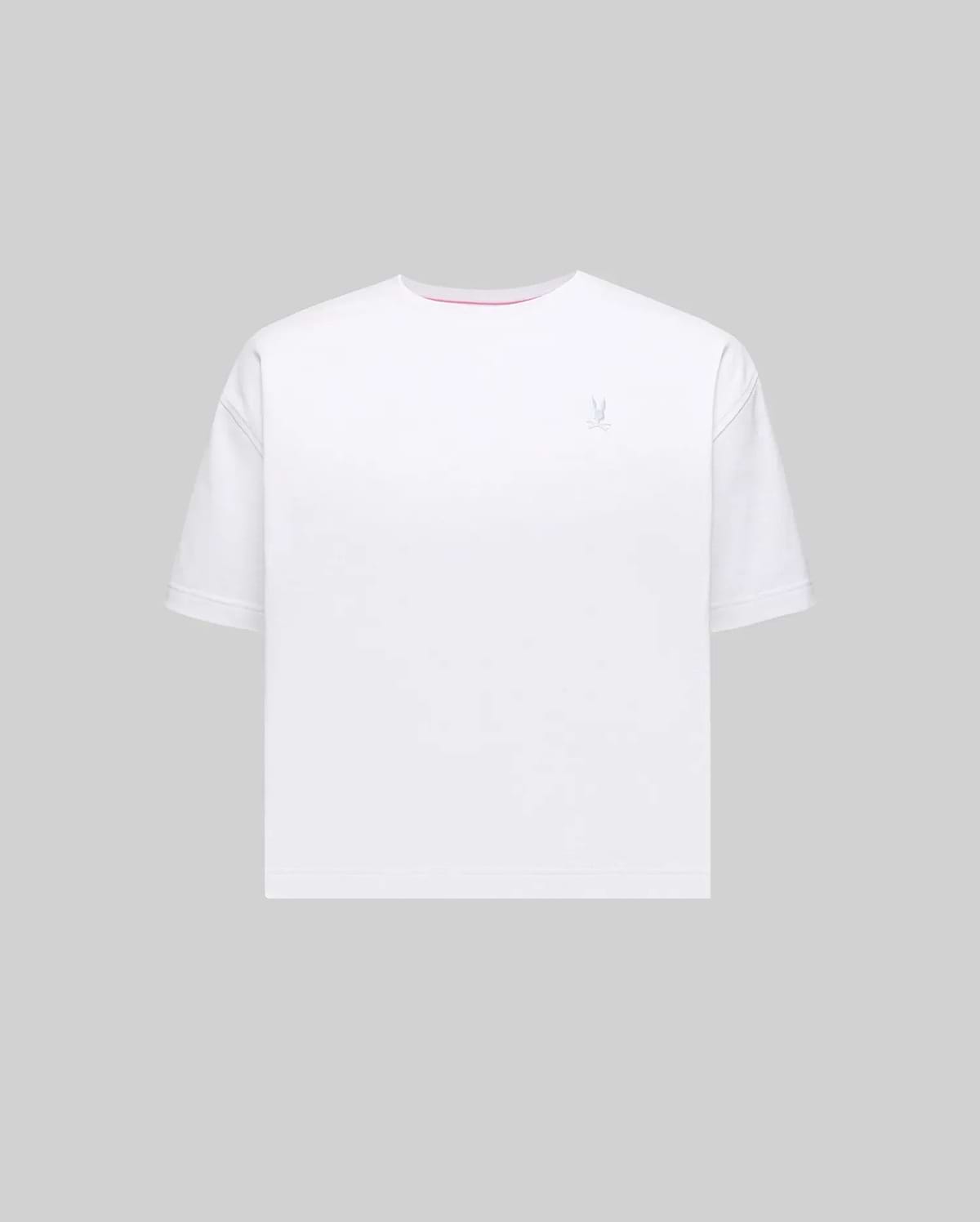 Women's Camille Oversized Fit Tee in white jersey knit, featuring a small embroidered light blue Psycho Bunny skull logo on the left chest and a subtle pink accent trim inside the crew neckline.