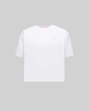 Women's Camille Oversized Fit Tee in white jersey knit, featuring a small embroidered light blue Psycho Bunny skull logo on the left chest and a subtle pink accent trim inside the crew neckline.