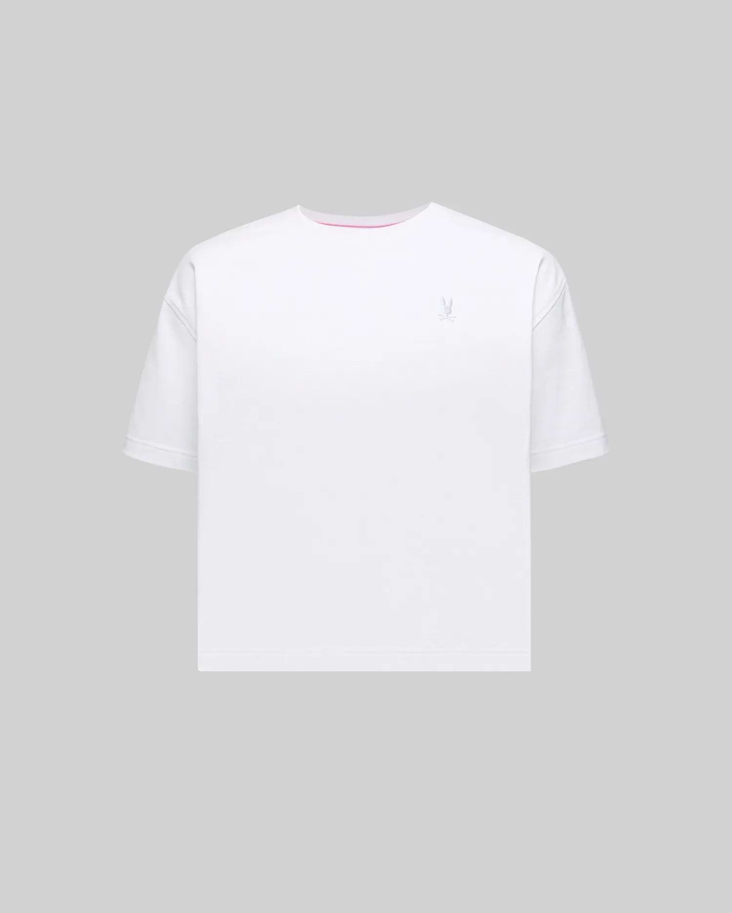 Women's Camille Oversized Fit Tee in white jersey knit, featuring a small embroidered light blue Psycho Bunny skull logo on the left chest and a subtle pink accent trim inside the crew neckline.