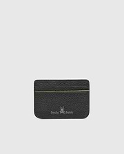 The CARD CASE - B6A409B200 by Psycho Bunny boasts a textured black leather design with a subtle green stripe near the top. Embossed at the bottom are the silver Psycho Bunny logo and name, set against a plain, light gray background for added elegance.