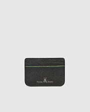 The CARD CASE - B6A409B200 by Psycho Bunny boasts a textured black leather design with a subtle green stripe near the top. Embossed at the bottom are the silver Psycho Bunny logo and name, set against a plain, light gray background for added elegance.