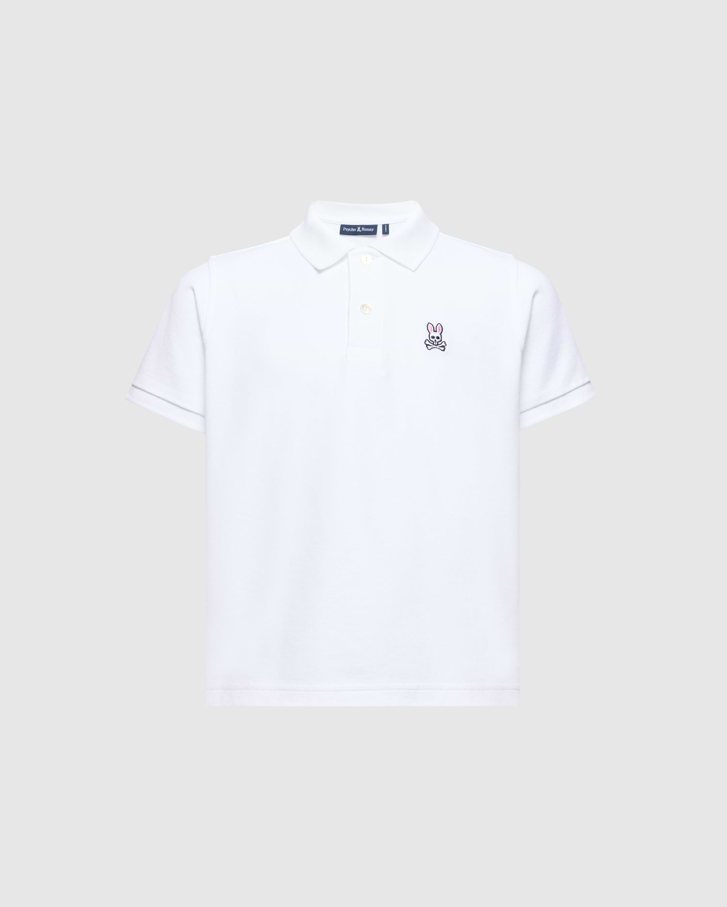 The Psycho Bunny KIDS CLASSIC PIQUE POLO SHIRT - B0K001CRPC is perfect for back-to-school. It features short sleeves, a collar, and an embroidered bunny logo on the left chest against a plain light gray background.