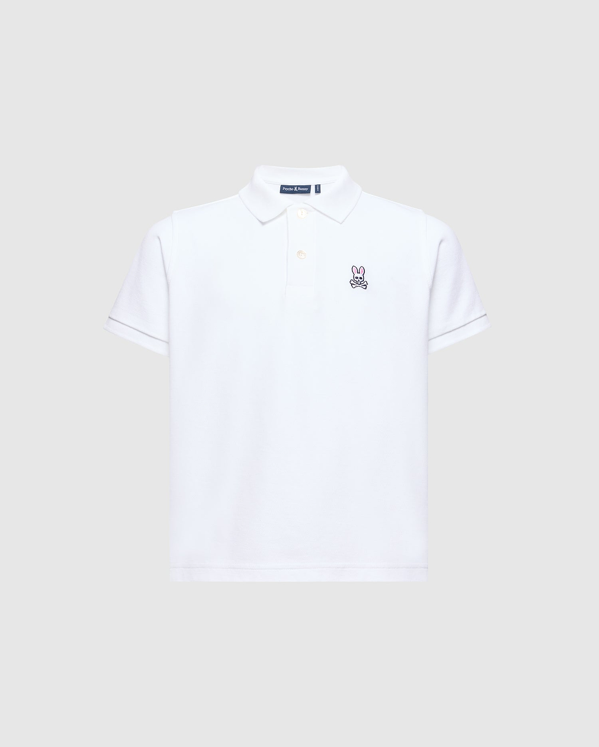 The Psycho Bunny KIDS CLASSIC PIQUE POLO SHIRT - B0K001CRPC is perfect for back-to-school. It features short sleeves, a collar, and an embroidered bunny logo on the left chest against a plain light gray background.
