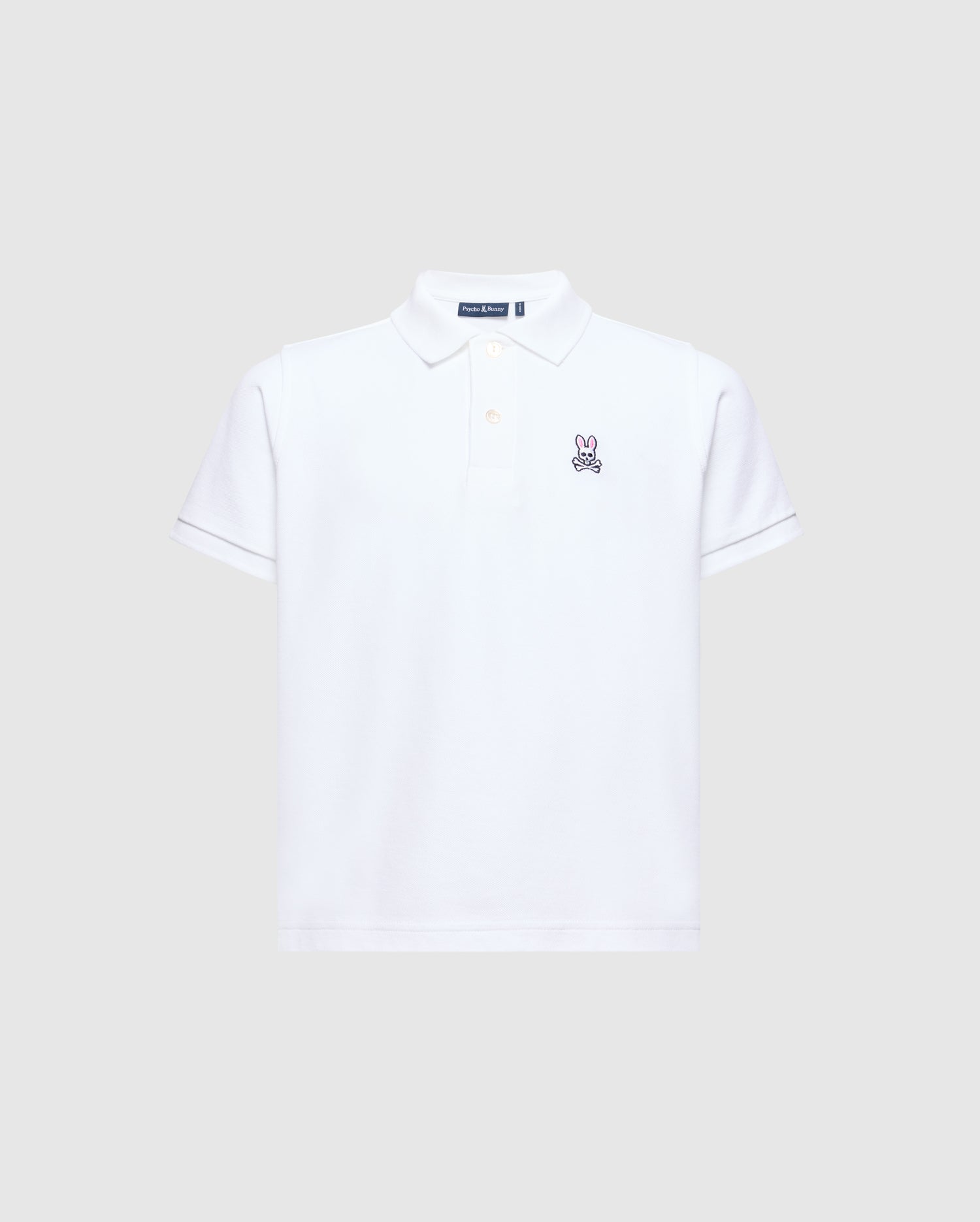 The Psycho Bunny KIDS CLASSIC PIQUE POLO SHIRT - B0K001CRPC is perfect for back-to-school. It features short sleeves, a collar, and an embroidered bunny logo on the left chest against a plain light gray background.