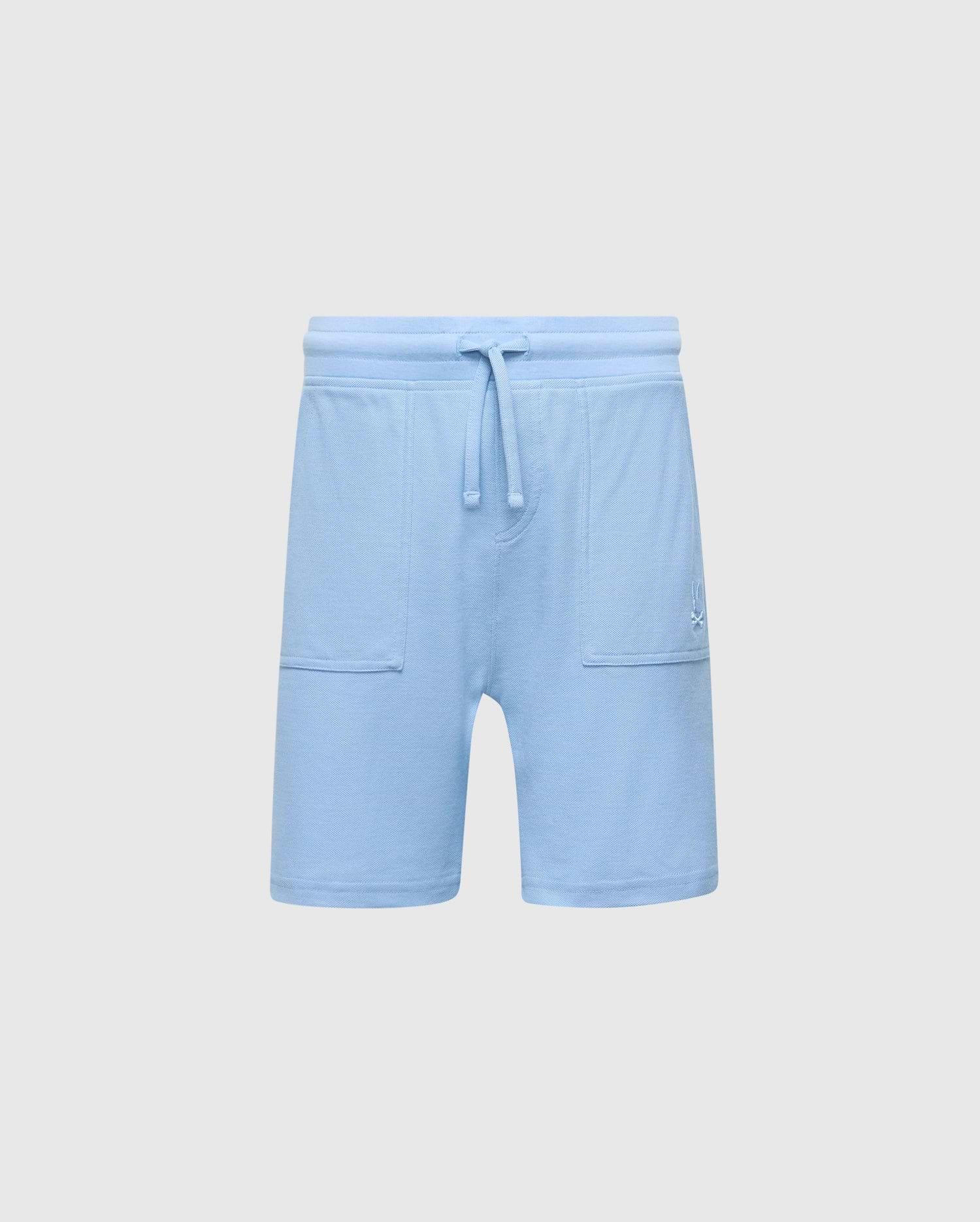The Psycho Bunny KIDS TAYLOR LIGHT PIQUE SWEATSHORT - B0R344F200 in light blue boasts a drawstring waistband, soft Pima cotton, two front pockets, and an embroidered bunny logo on the left side, offering a casual-chic design perfect for everyday wear.