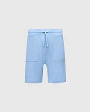 The Psycho Bunny KIDS TAYLOR LIGHT PIQUE SWEATSHORT - B0R344F200 in light blue boasts a drawstring waistband, soft Pima cotton, two front pockets, and an embroidered bunny logo on the left side, offering a casual-chic design perfect for everyday wear.