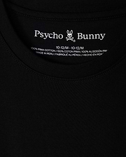 Close-up of a black KIDS HAWAII CITY TEE (B0U169Y1PC) by Psycho Bunny, crafted from Pima cotton with the brand name and bunny logo at the neckline. Includes size and fabric details, highlighting it's made in Peru, paralleling the volcanic islands' rich natural beauty.
