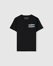 A black Pima cotton jersey T-shirt designed for kids, featuring a striking bunny skull logo on the chest, complemented by red stars and light blue stripes. With its "Psycho Bunny" label, it serves as the ideal Chicago tee to display a bold sense of style.
