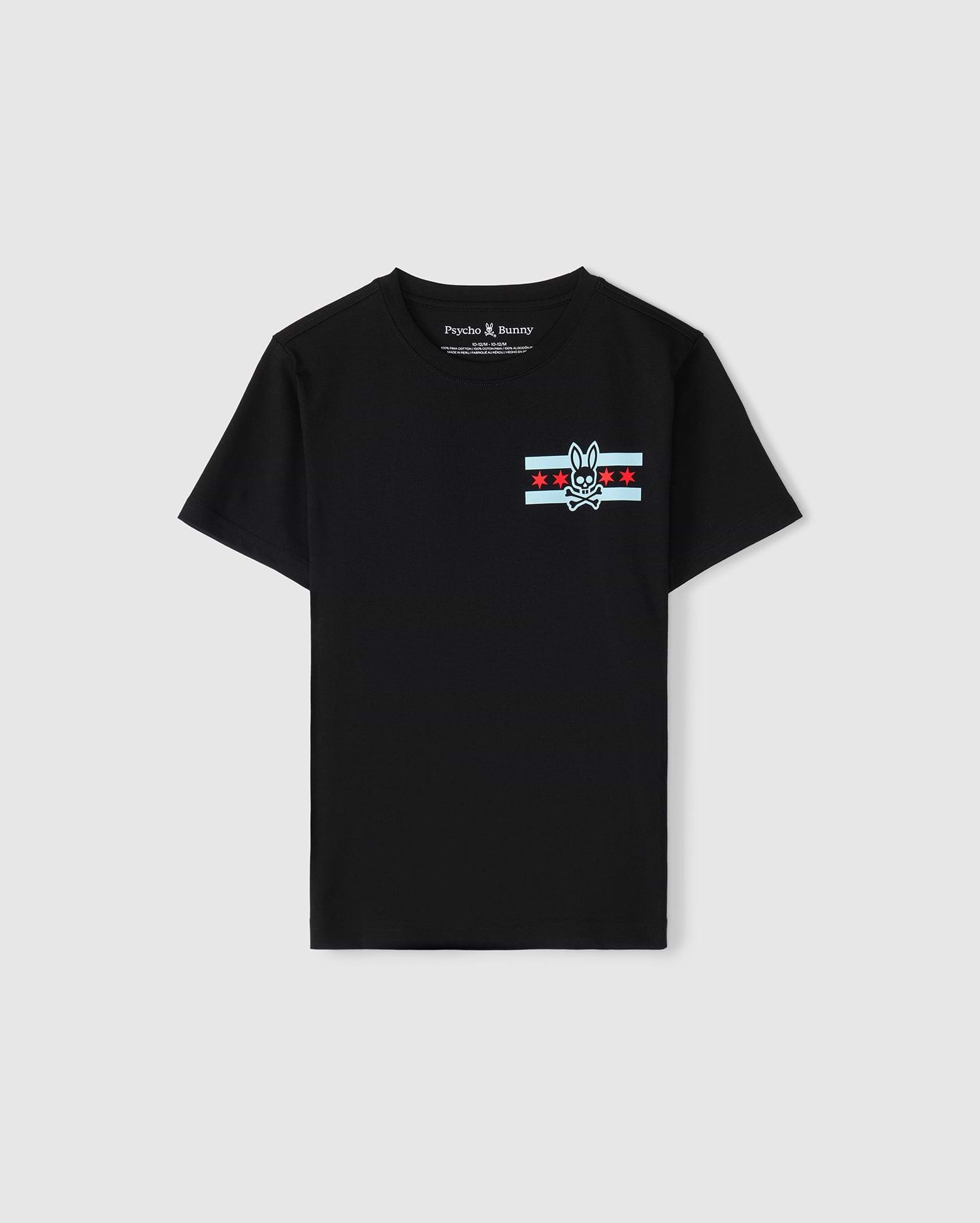A black Pima cotton jersey T-shirt designed for kids, featuring a striking bunny skull logo on the chest, complemented by red stars and light blue stripes. With its "Psycho Bunny" label, it serves as the ideal Chicago tee to display a bold sense of style.