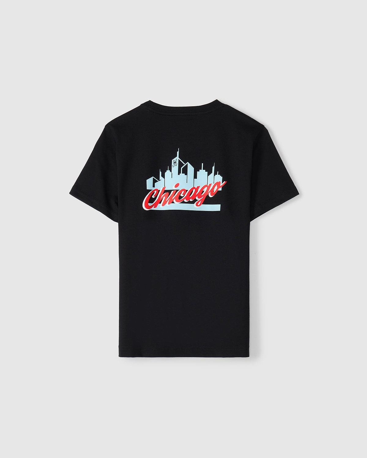 The Kids Chicago City Tee by Psycho Bunny, available in black, is made from soft Pima cotton jersey and showcases a light blue skyline silhouette with "Chicago" prominently written in red cursive below. This eye-catching design is centered on the back of the T-shirt.