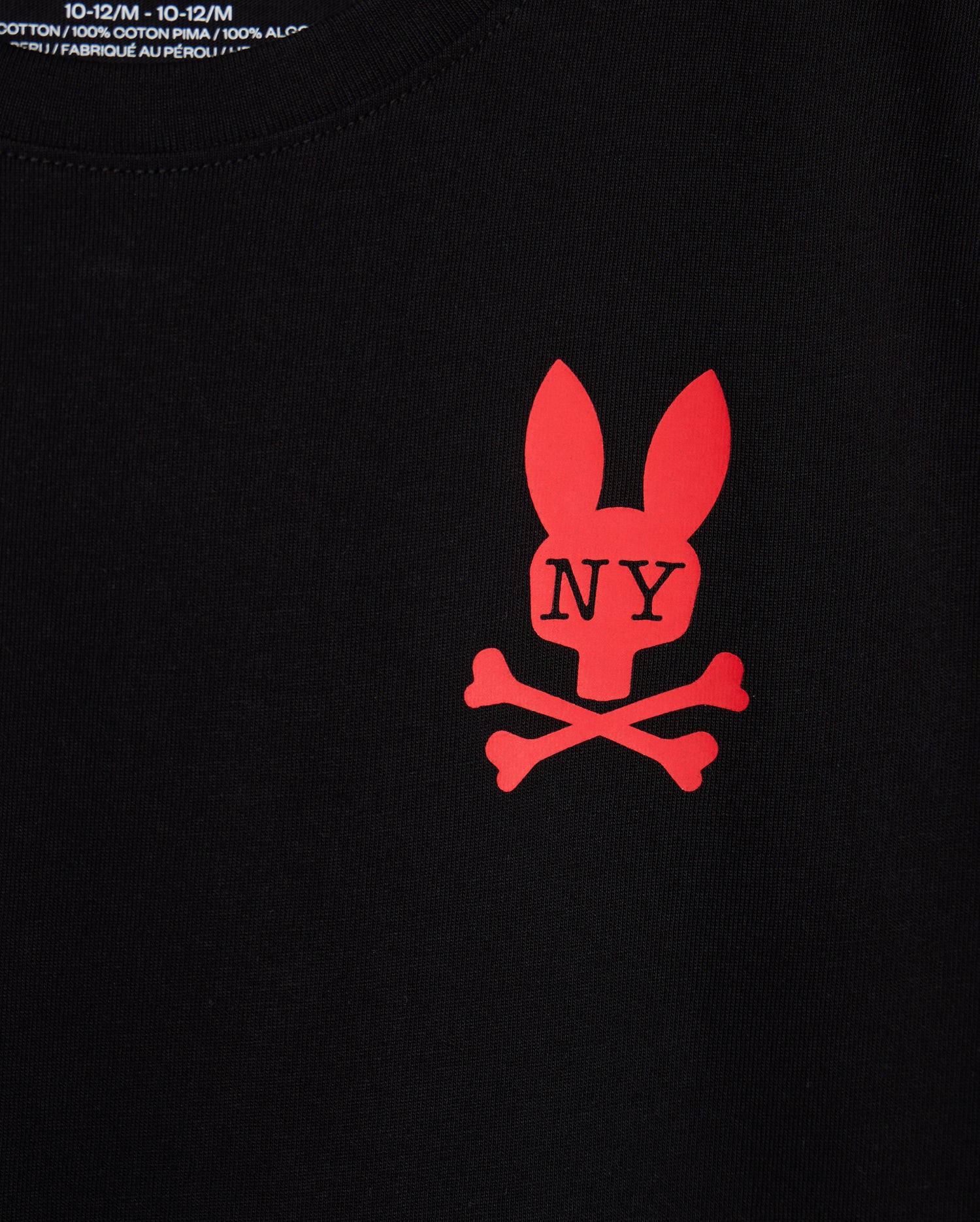 This kids' New York City tee, designed by Psycho Bunny, is crafted from luxurious Pima cotton and comes in black with a bold red design. It features a stylized bunny head above crossed bones, accented with "NY" on the forehead, perfectly capturing the edgy spirit of a New York tee.