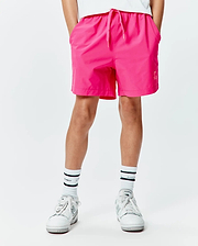 Kids Samos Hydrochromic Printed Swim Trunk in vibrant fuchsia, featuring a relaxed fit, smooth quick-dry fabric, drawstring waist, and a small tonal Psycho Bunny logo on the lower right leg.
