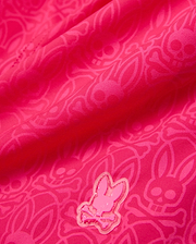 Kids Samos Hydrochromic Printed Swim Trunk in vibrant fuchsia, featuring a subtle tonal hydrochromic Psycho Bunny skull and crossbones pattern, with a raised, glossy pink Psycho Bunny logo emblem.