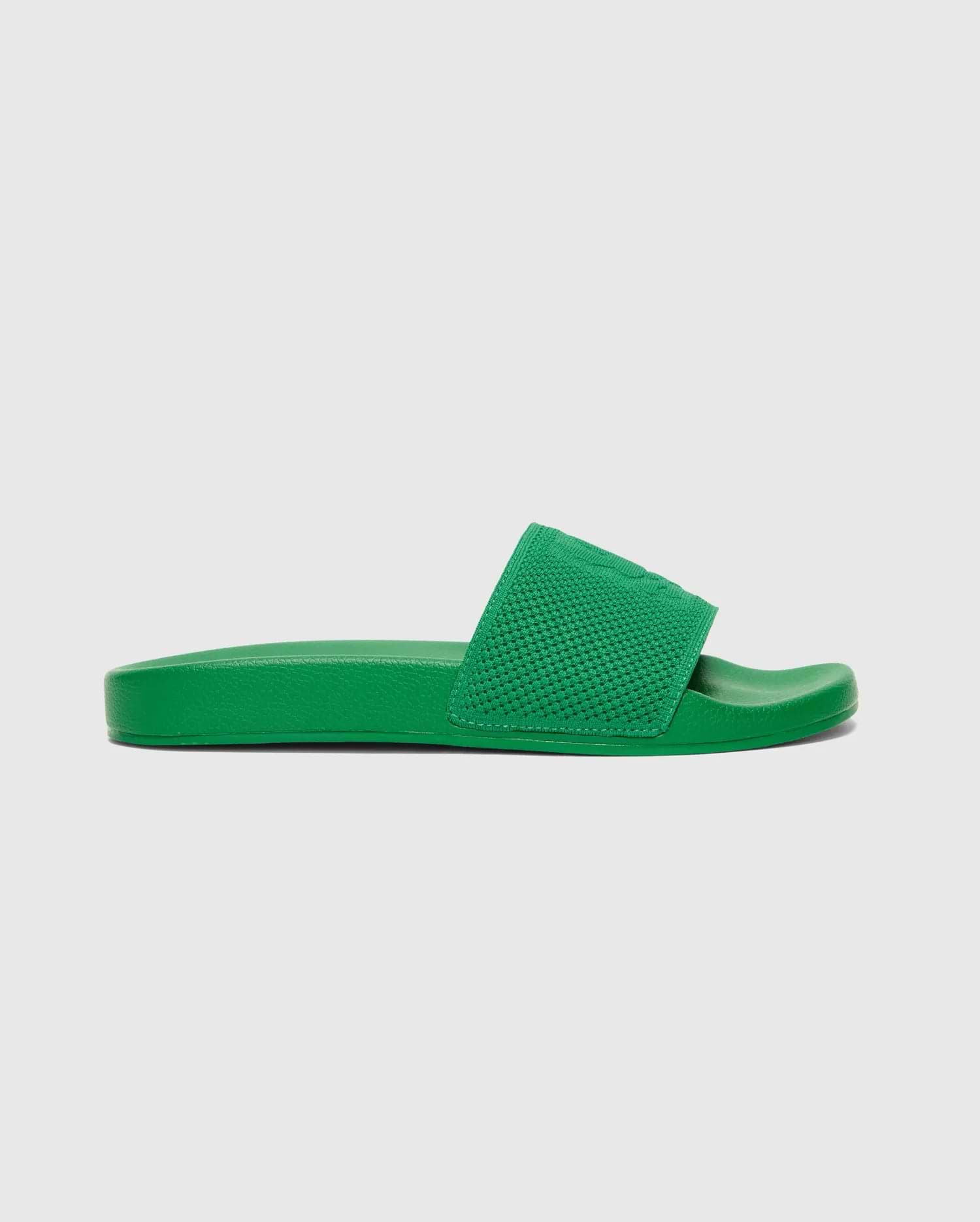 Mens Knit Slides in a vibrant green, featuring a textured knit strap with a subtly embossed Psycho Bunny skull logo, offering a bold streetwear aesthetic.