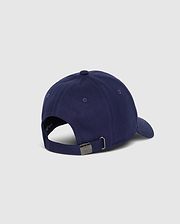 A rear view of the Psycho Bunny MENS CLASSIC BASEBALL CAP - B6A816A1HT in navy blue, featuring an adjustable strap with a metal buckle. Made from 100% cotton, this cap is set against a plain, light grey background.