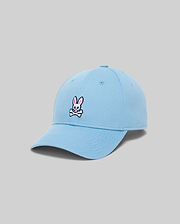Mens Classic Baseball Cap in sky blue cotton twill, featuring a classic fit and a medium-sized embroidered Psycho Bunny skull logo in pink, white, and black on the front.