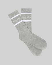 Mens 3 Pack Sport Sock in grey jersey knit with ribbed cuffs, featuring two bold white stripes and the Psycho Bunny text logo prominently displayed on the cuff.