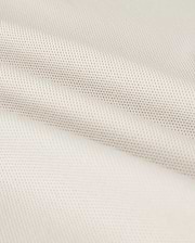 Close-up of a softly folded, light beige textured fabric with a subtle grid pattern, showcasing its smooth and pliable nature. The gentle folds add depth and highlight the luxurious Pima cotton's fine weave and soft sheen, hinting at the perfect fit for a Psycho Bunny Men's Classic Pique Polo Shirt - B6K001B200.