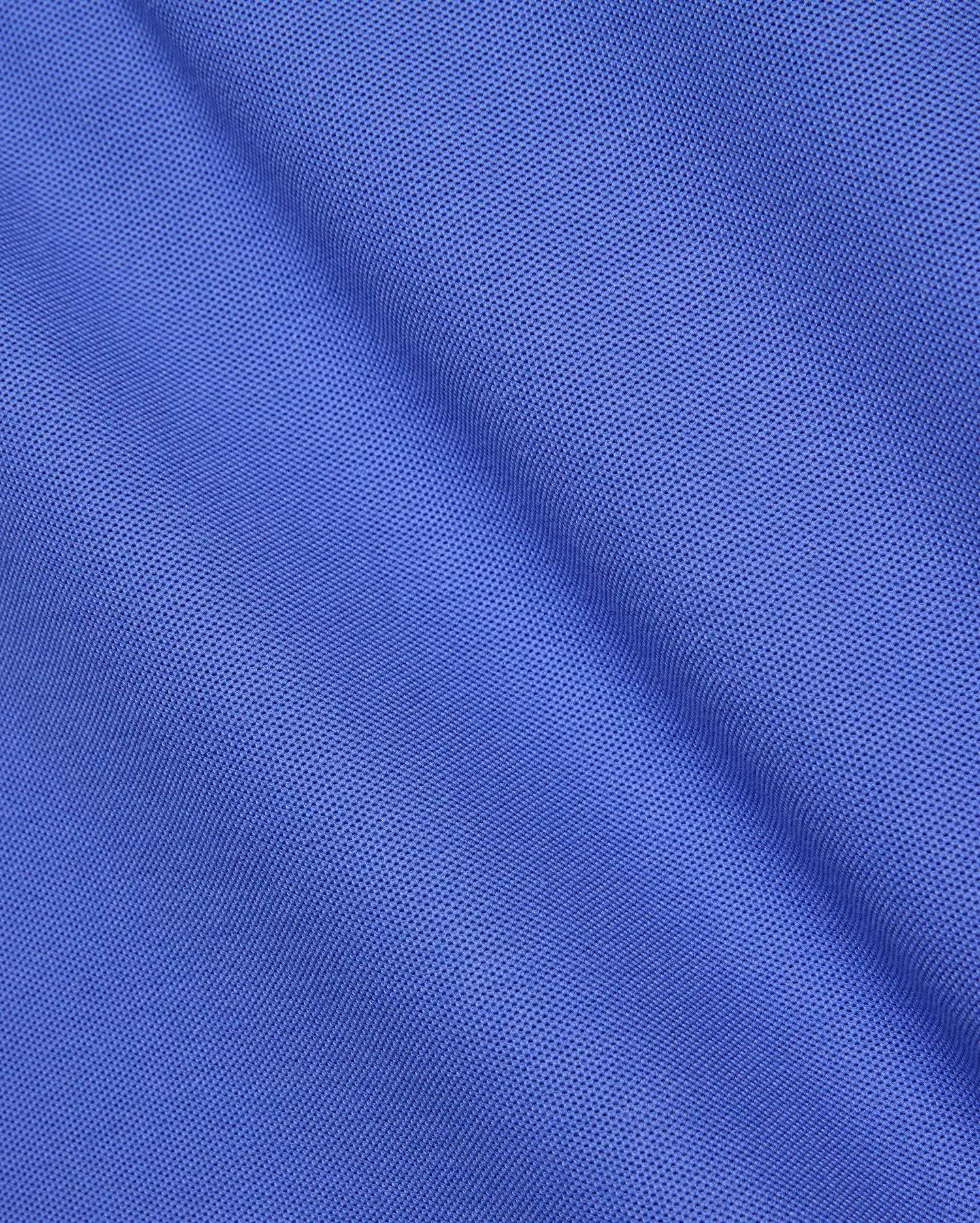 Premium Mens Classic Pique Polo by Psycho Bunny, crafted from a vibrant royal blue, finely textured pique knit fabric with a subtle sheen and soft drape, embodying refined streetwear style.