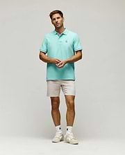 Mens Classic Pique Polo in aqua, featuring a classic fit, pique texture, and a small embroidered white and black Psycho Bunny skull logo on the left chest, with ribbed cuffs.