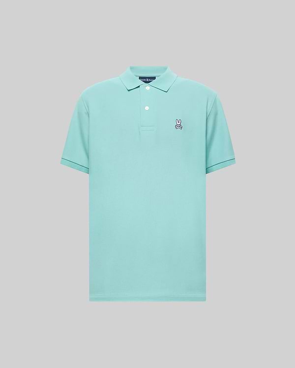 Mens Classic Pique Polo in aqua, a classic fit pique knit with a small embroidered white and pink Psycho Bunny skull logo on the left chest, featuring a two-button placket.