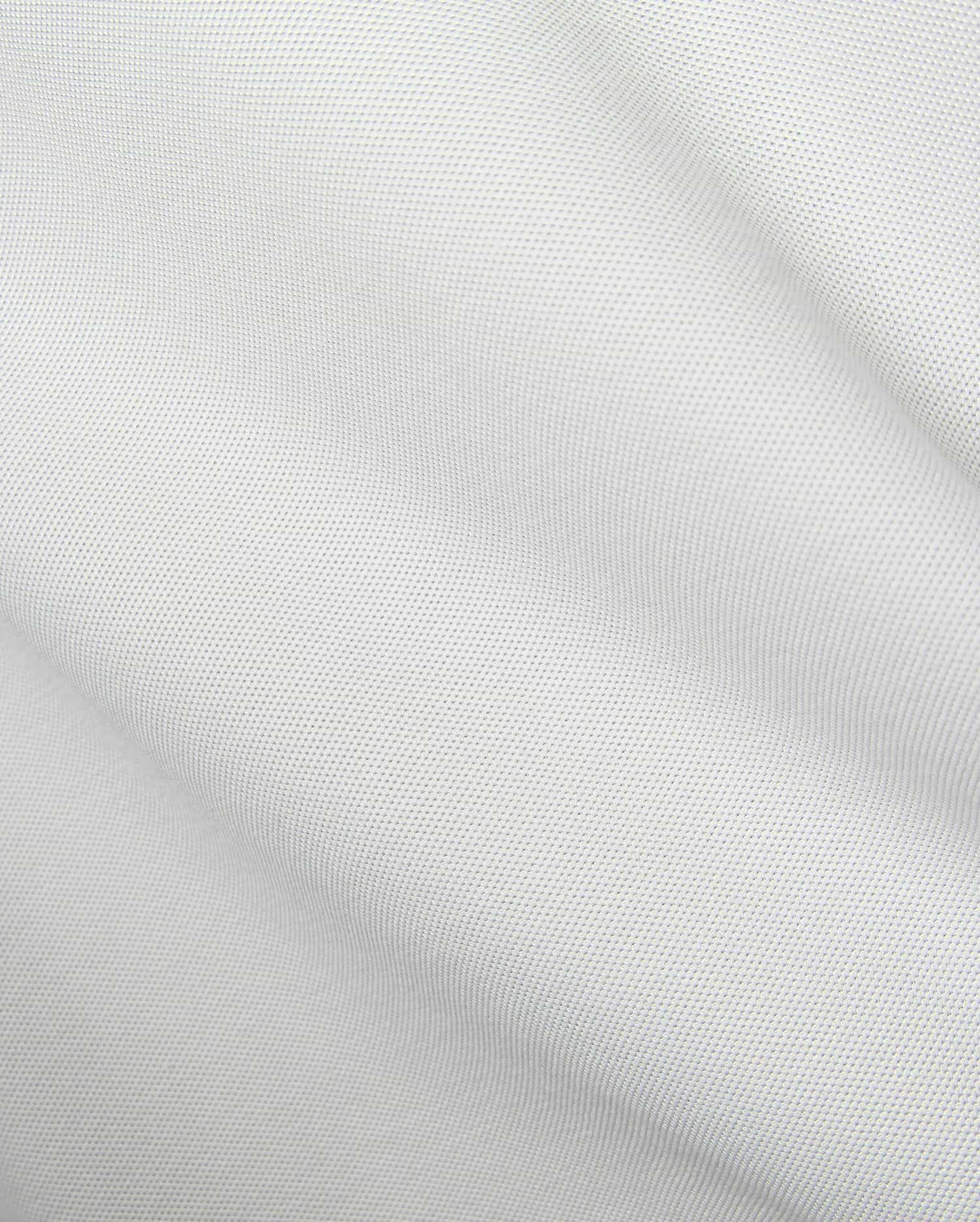 Mens Classic Pique Polo in crisp white, showcasing a distinct pique fabric texture and the iconic small embroidered Psycho Bunny skull logo on the left chest.