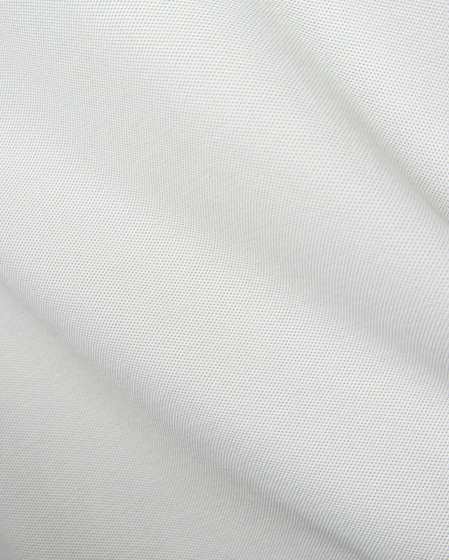 Mens Classic Pique Polo in crisp white, showcasing a distinct pique fabric texture and the iconic small embroidered Psycho Bunny skull logo on the left chest.