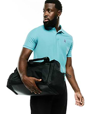 Men's Classic Pima Pique Polo in vibrant aqua blue, featuring a classic fit and a small, embroidered pink, white, and black Psycho Bunny skull logo on the left chest. (4)