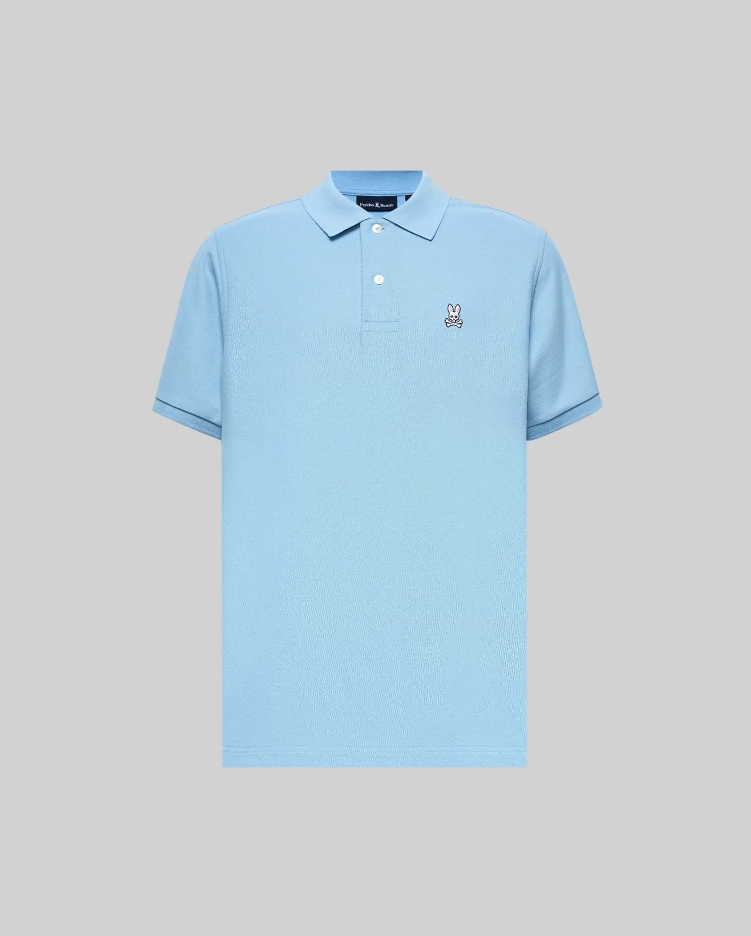 Mens Classic Pique Polo in sky blue, featuring a classic fit, pique texture, two-button placket, ribbed collar, dark blue trim on cuffs, and a small, embroidered Psycho Bunny skull logo on the left chest.