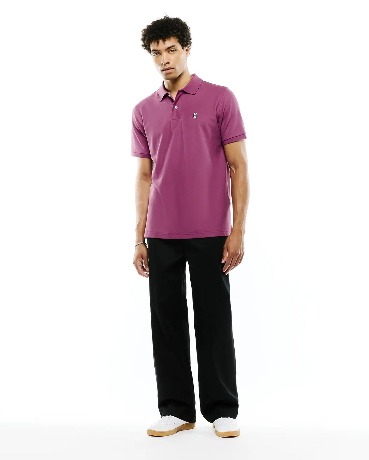 Mens Classic Pique Polo in deep plum pique fabric with a classic fit, featuring a two-button placket and a small white embroidered Psycho Bunny skull logo on the left chest.