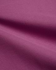 Psycho Bunny Mens Classic Pique Polo fabric in a vibrant deep magenta, highlighting the premium, breathable pique knit texture with elegant, soft folds, perfect for refined streetwear.