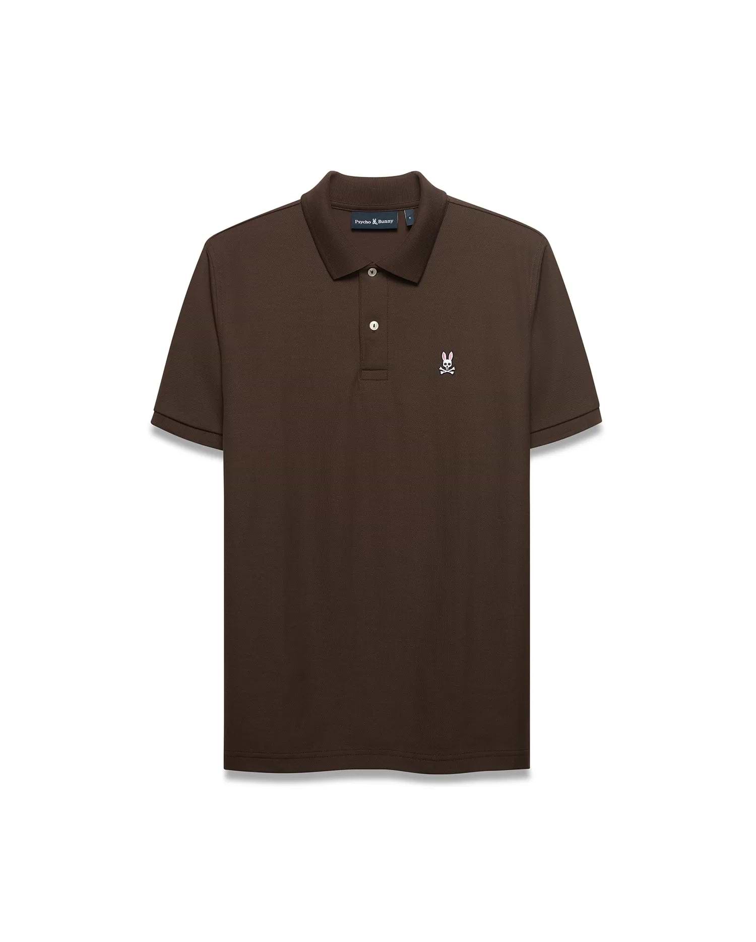 Men's Classic Pima Pique Polo in rich brown pique fabric, featuring a classic fit, two white buttons, and a small embroidered white and pink Psycho Bunny skull logo on the left chest. (1)